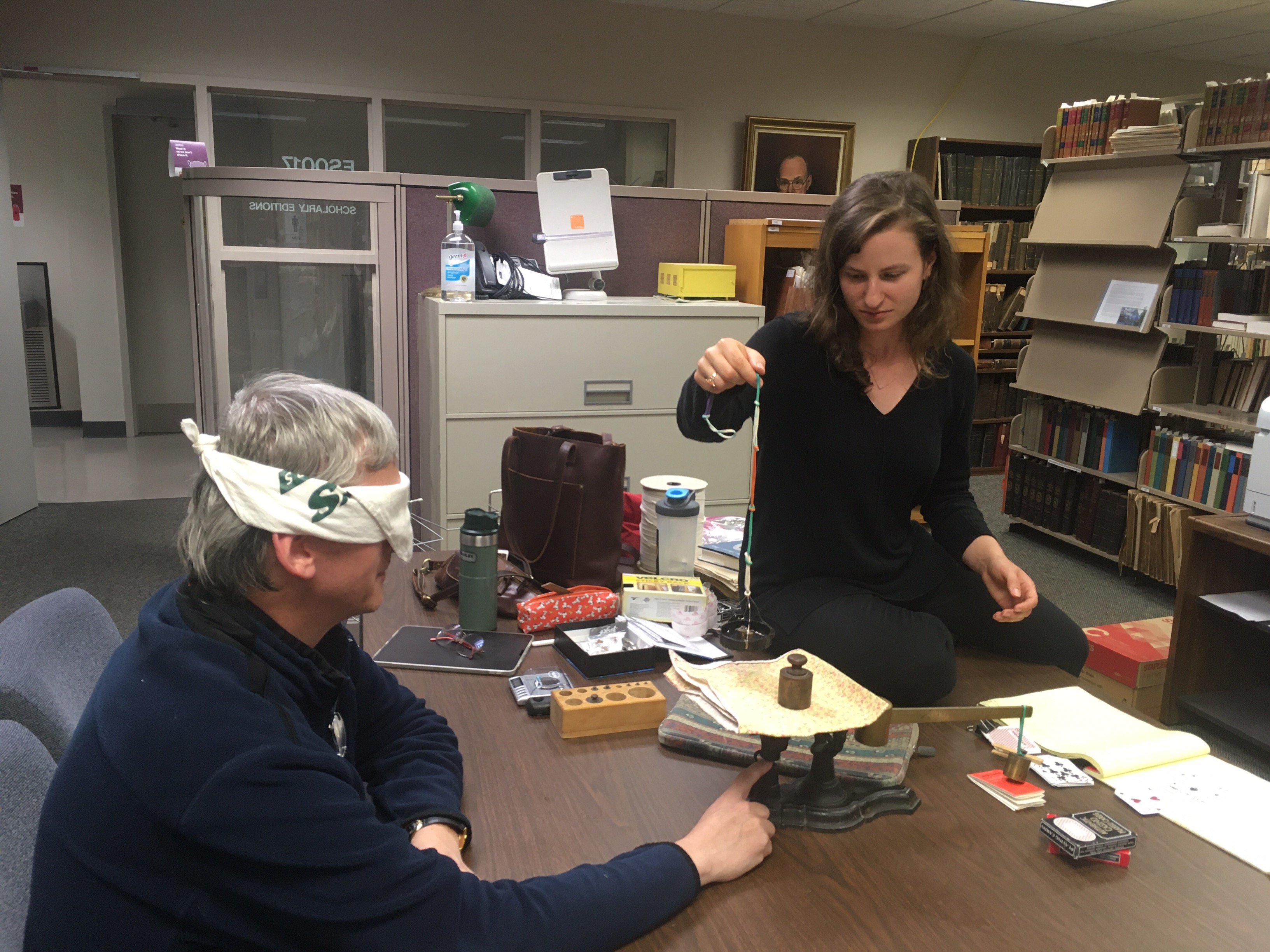 André de Tienne (left), acting as experimental subject for me (right) while we tried to figure out how the postal scale mechanism applied pressure to the finger.